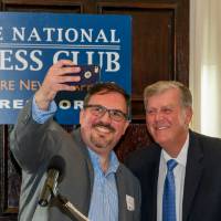 speaker takes selfie with President Haas